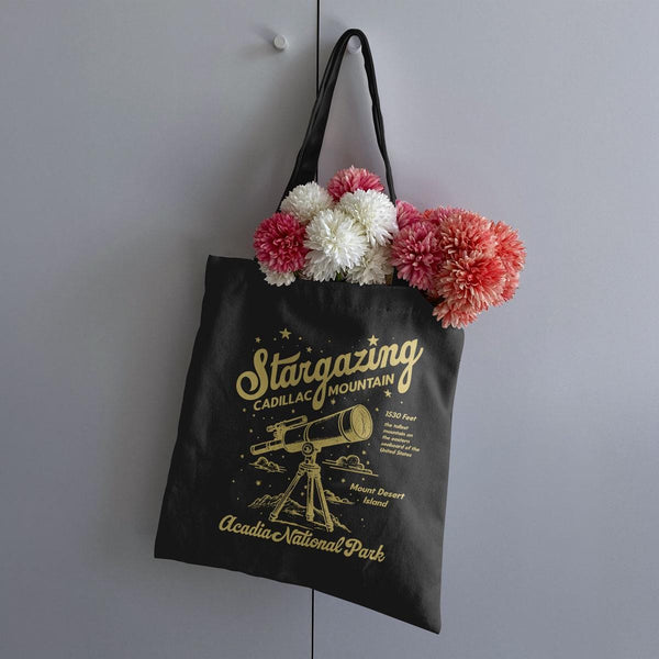 a black shopping bag hanging on a wall