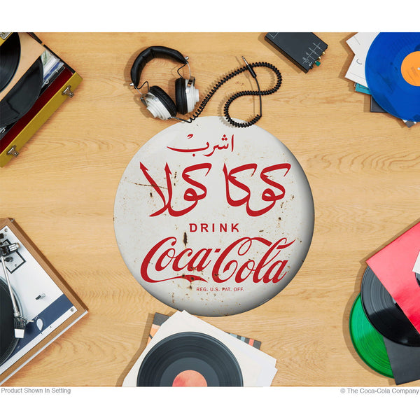 Drink Coca-Cola White Disc Floor Graphic Moroccan Arabic Script Grunge